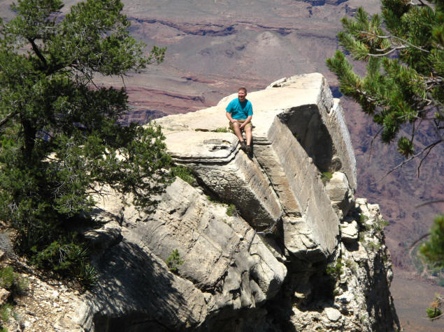 Jason sitting on an outcropping in Grand Canyon.