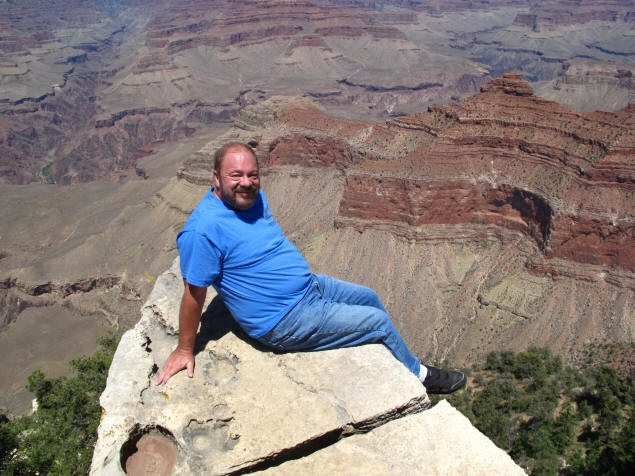 Me on the outcropping in Grand Canyon.