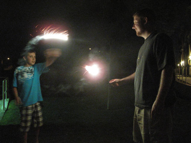 Zach and Jason shooting fireworks.
