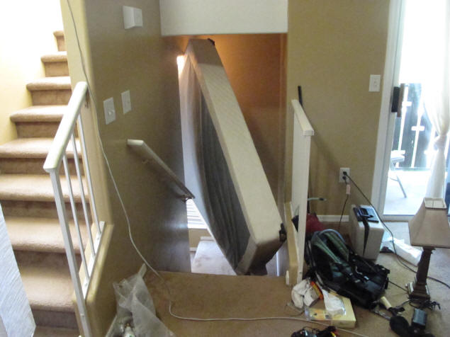 Box spring stuck in stairwell.