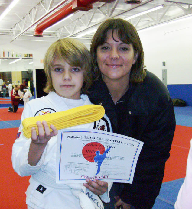 Zach, yellow belt, certificate, and proud Mom Jenny.