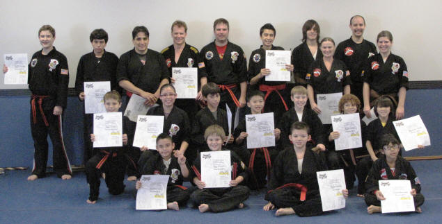 Zach and his dojomates with their new belts and certificates.