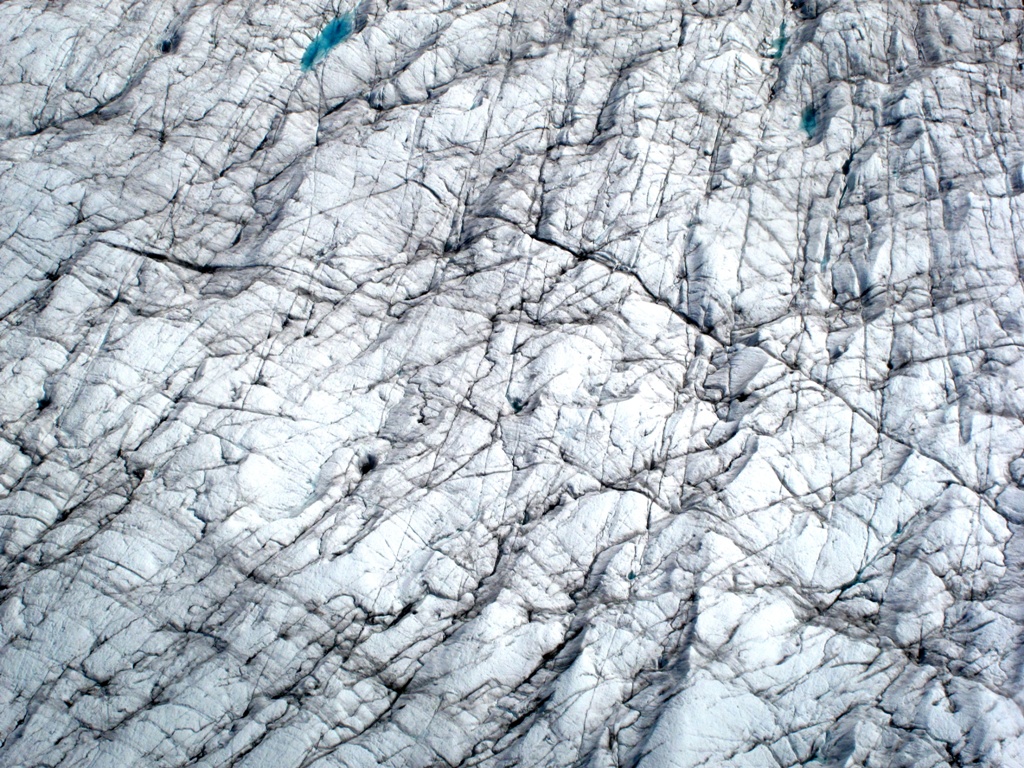 The striated surface of a glacier.