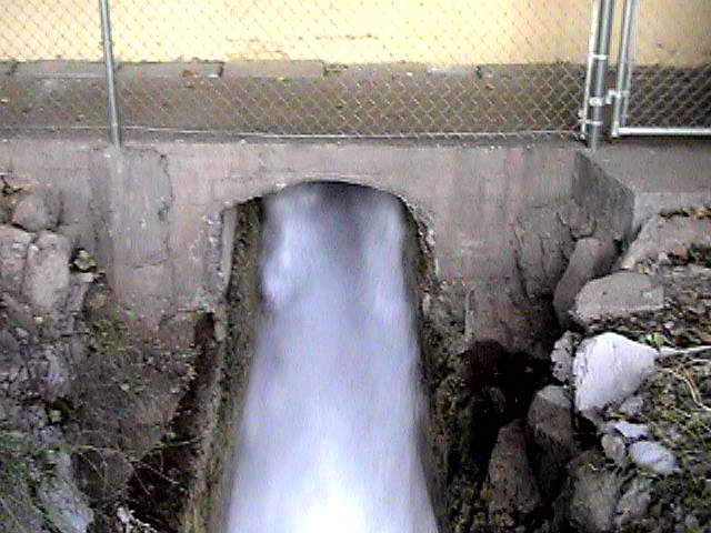 Water gushing from the decommissioned Childs Power Plant, 2001.