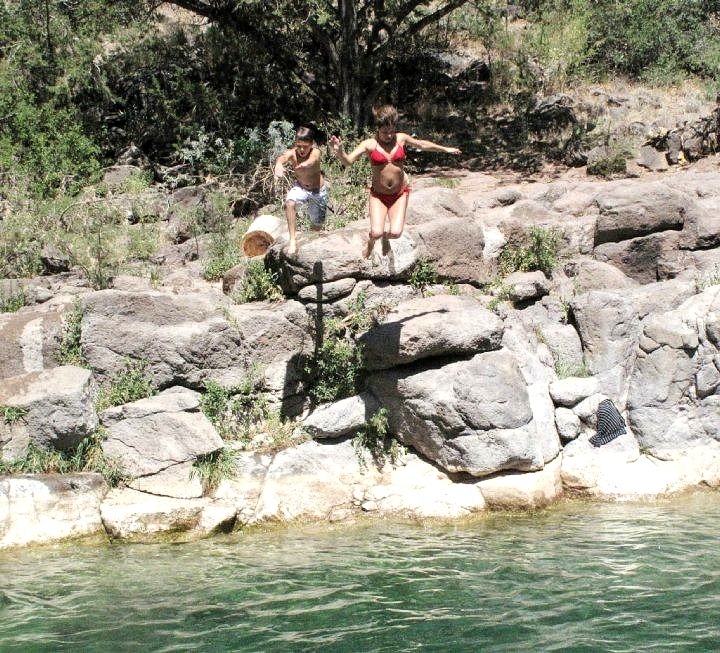 Zach and Jenny jump into Fossil Creek.