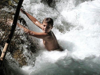 Zach fighting the current in Fossil Creek.