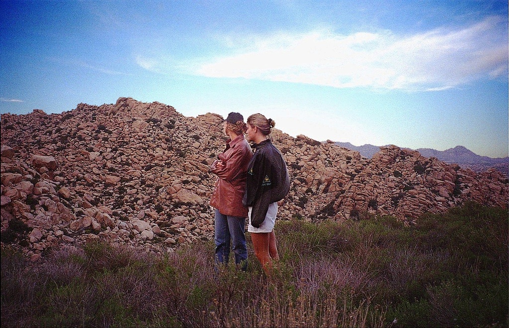 Karen and Jenny observe a stony outcropping.