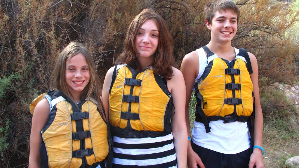 Patricia, Brianna and Zach in life jackets.