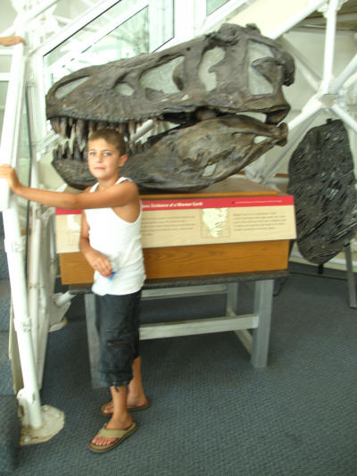 Zach with a T-Rex fossil cast.