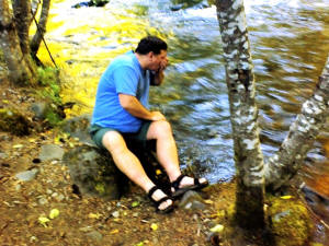 Michael risks his life by drinking river water.